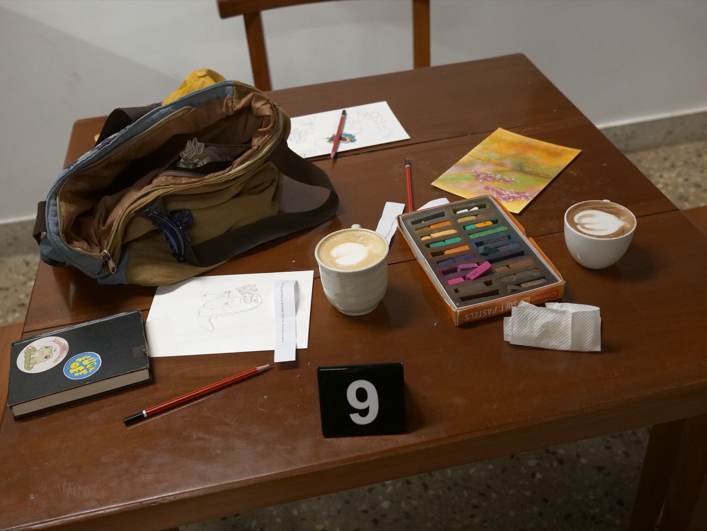 Participants gather around an artist working with colourful materials at the Human Music Art Party.