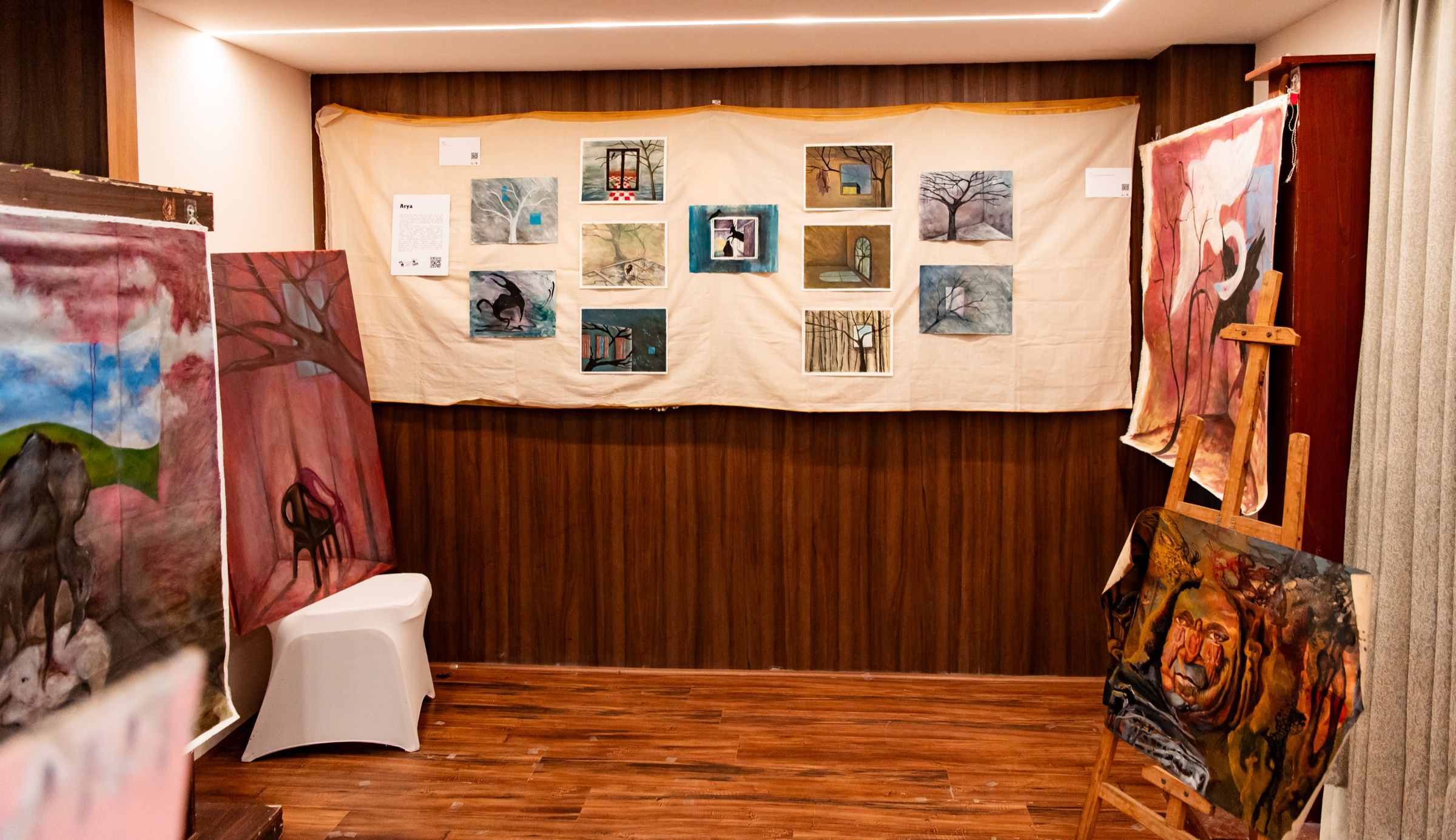 Paintings exploring dreams and memory displayed on fabric, easels and the gallery walls.