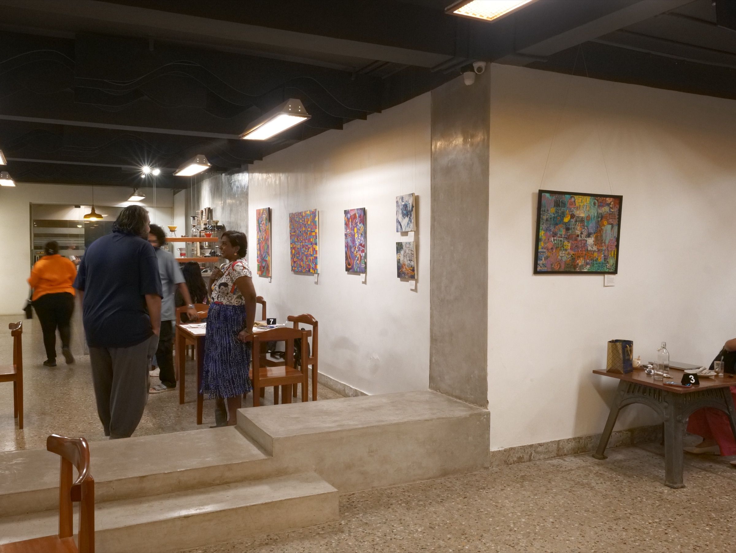 Visitors gather throughout Vinyl & Brew during the opening of Human Music.