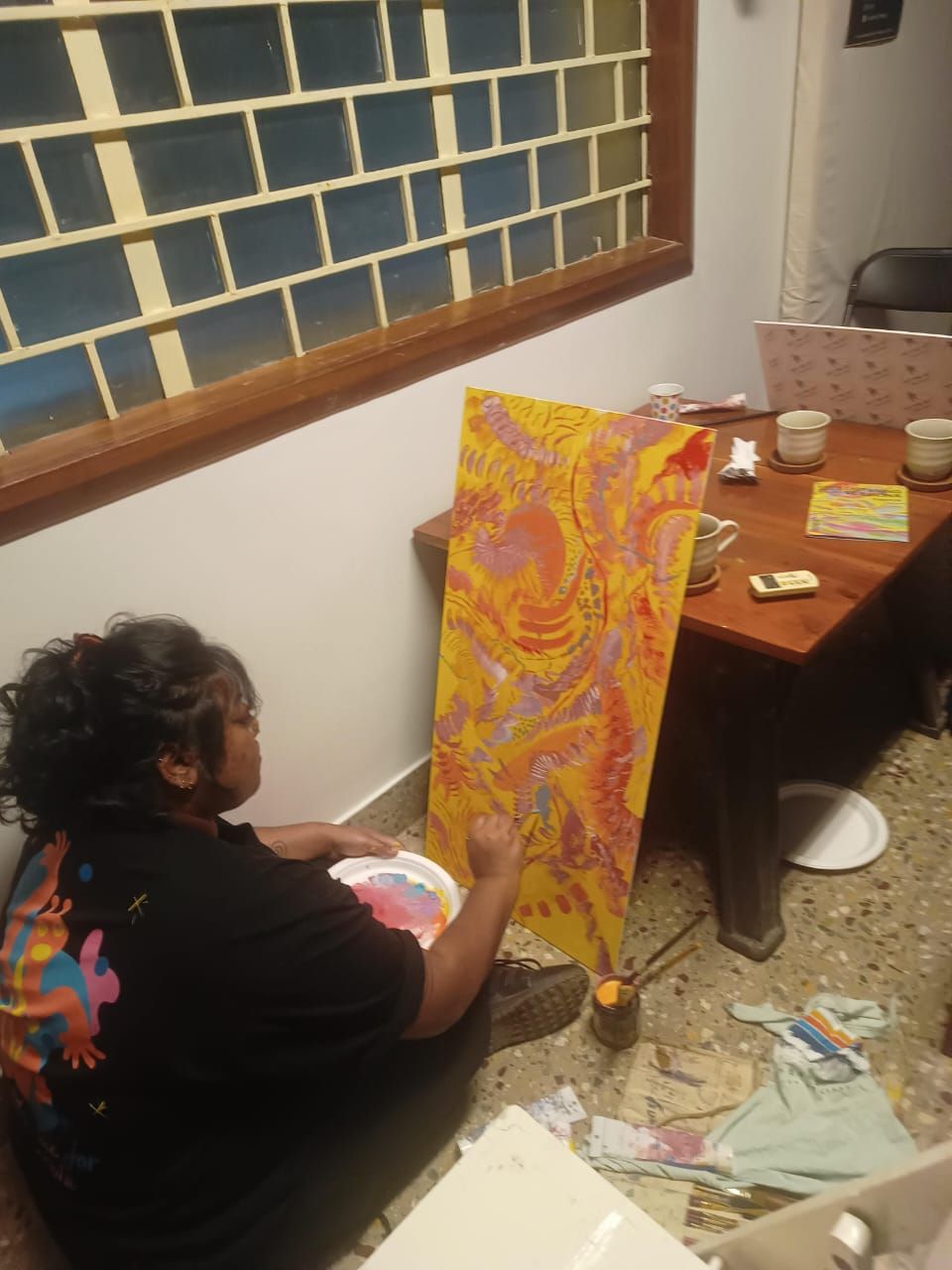 The completed colourful abstract Exotica live painting.