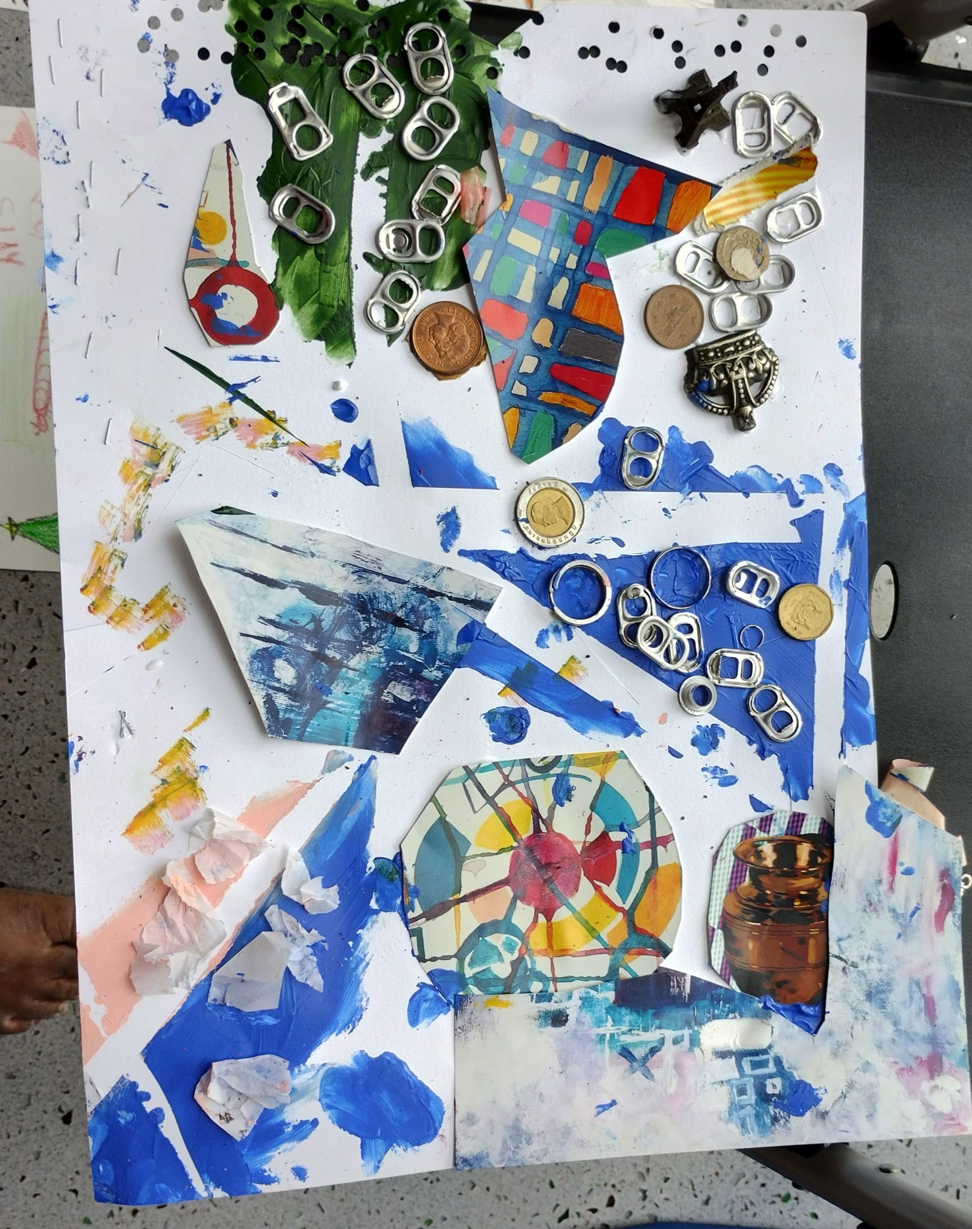 A mixed-media artwork made with painted paper, coins, metal tabs and found images.