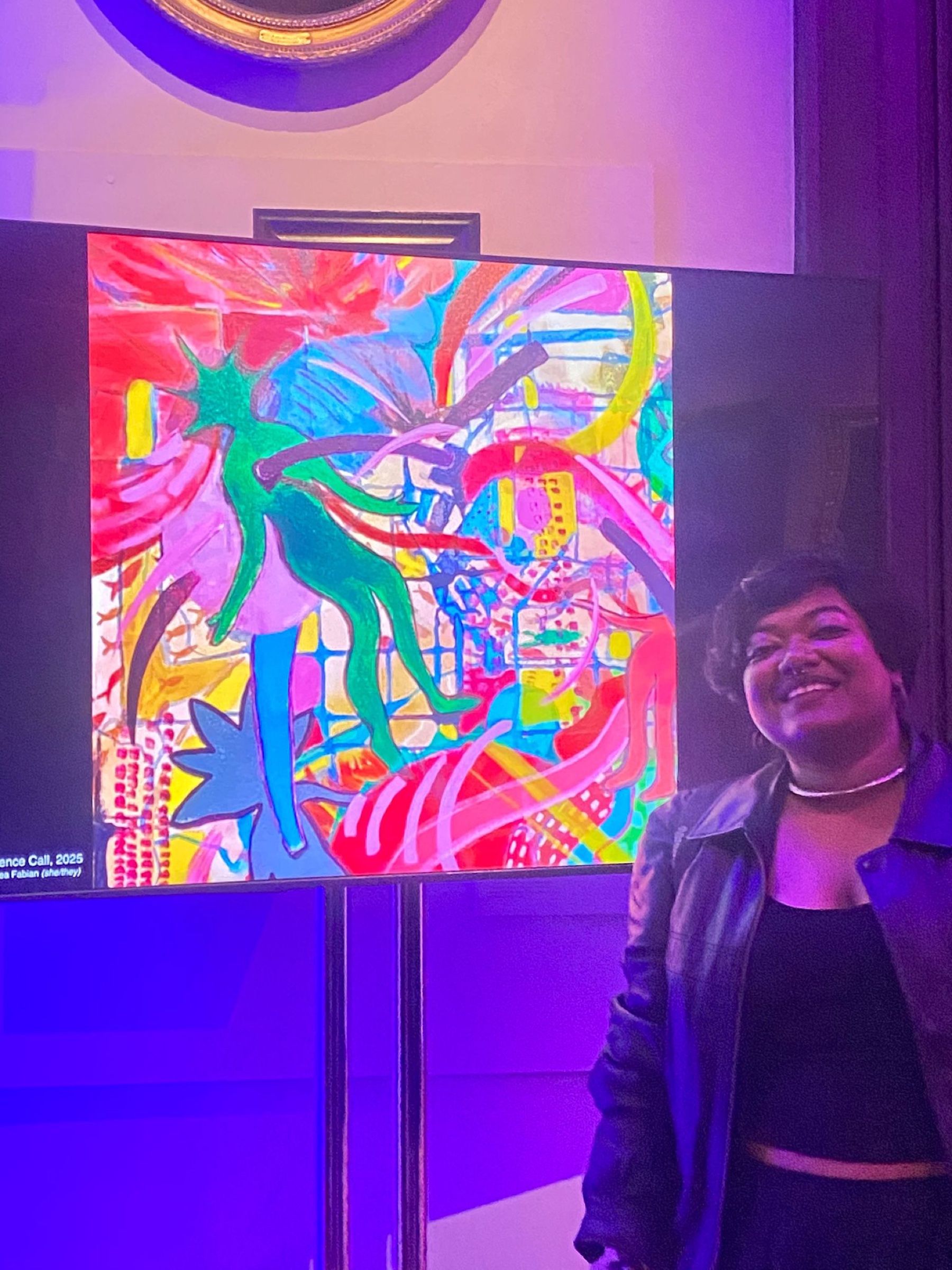 Rhea Fabian beside a digital display of Interdimensional Conference Call at The Queen's House.